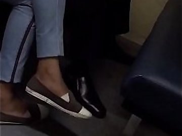 sexy girl flats dangling in the office train